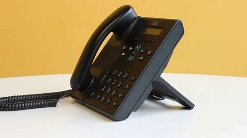 Making a call using desk phone Stock Footage 75941476