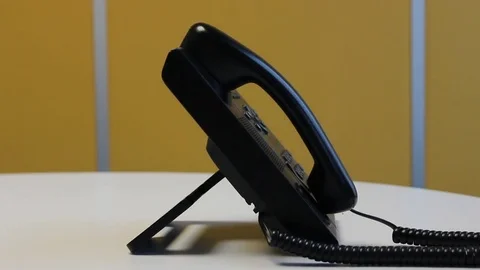Making a call using desk phone Stock Footage 75941517