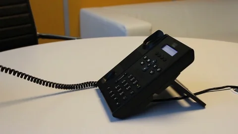 Making a call using desk phone Stock Footage 75941589