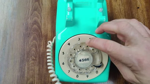 Making Calls with Old Analog Rotary Dial Telephone Stock Footage 304047383