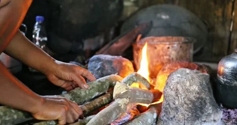 Making a campfire to heat coffee from the beans Stock Footage 301747631