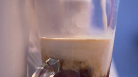 Making cappuccino coffee going out from a coffee machine Stock-Footage 104106975