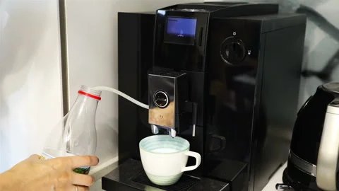 Making cappuccino in a coffee machine Stock Footage 105959589