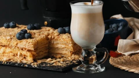 Making cappuccino or latte coffee in a slow motion Stock Footage 287075880