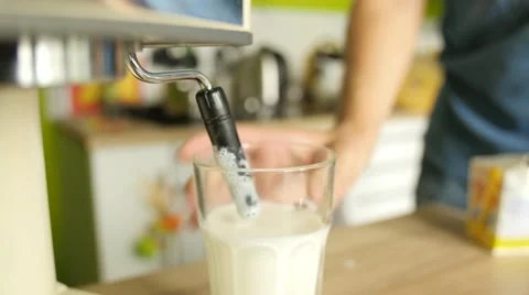 Making cappuccino: preparing hot milk foam and pouring coffee in it Vídeos de archivo 68175856