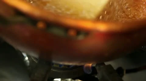 Making caramel in a copper pot Stock Footage 11401119