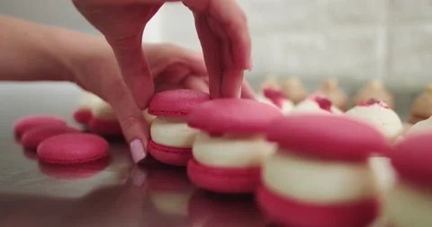 Making Caramel Macarons : Close Up Shot Of Connecting Two Halves Of Macaroons Stock Footage 150398519