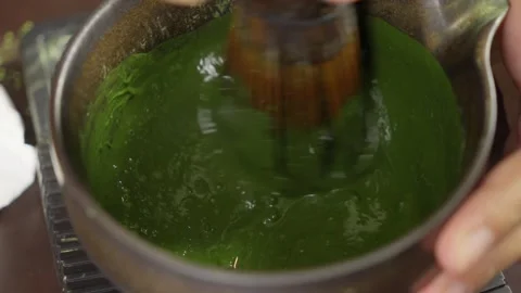 Making Ceremonial Matcha Tea with Matcha Whisk. Close up Stock Footage 334501061