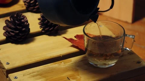 Making chammomile herbeal tea from kettle Stock Footage 323121431
