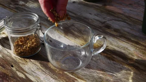 Making chamomile herbal tea on rustic background Video stock 171111214