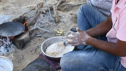 Making chapati bread in desert Stock Footage 170618765