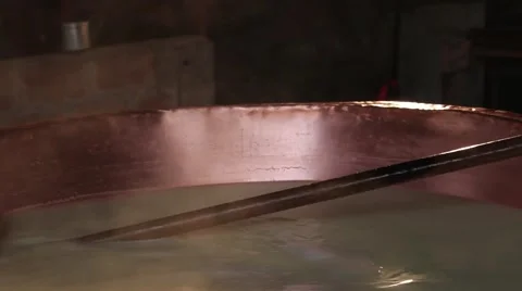 Making cheese, close up of mixed warm milk Stock Footage 68752207