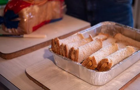 Making cheese rolls iconic new zealand dish cooking grating Stock Photos