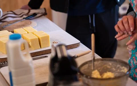 Making cheese rolls iconic new zealand dish cooking grating Stock Photos