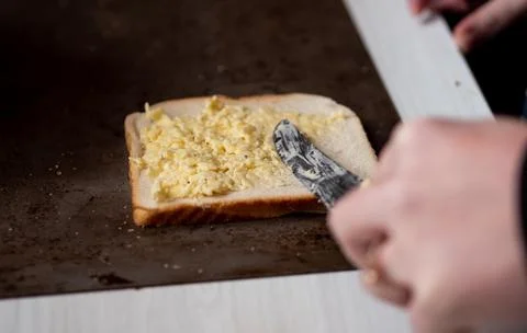 Making cheese rolls iconic new zealand dish cooking grating Foto stock