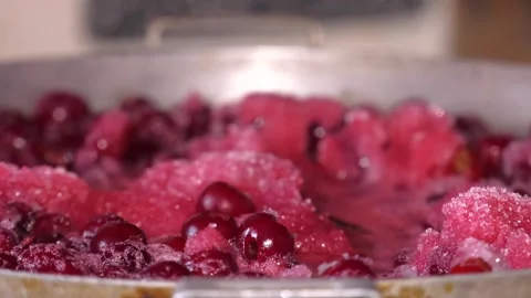 Making cherry jam berries boil in its own juice with sugar close-up. Stock Footage 119137646