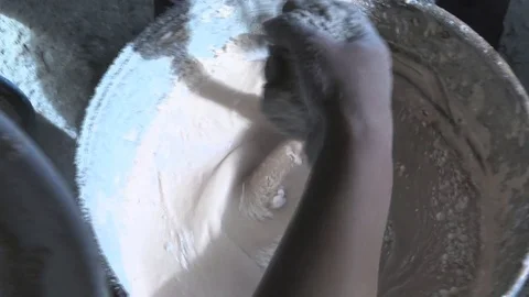 MAKING THE CHESTNUT MUSH IN A CAULDRON POUREDIND CHESTNUT FLOUR IN THE DOUGH Stockbeeldmateriaal 81036083