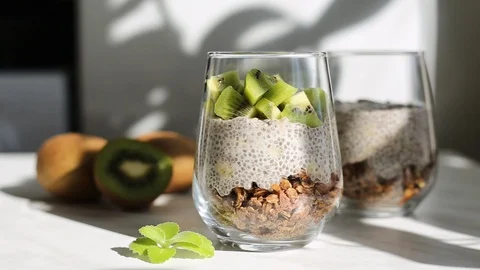 Making chia pudding with kiwi. Stock Footage 128346934