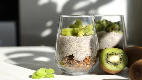 Making chia pudding with kiwi. Stock Footage 128347132