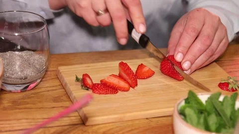 Making chia pudding with strawberries Stock Footage 241797598