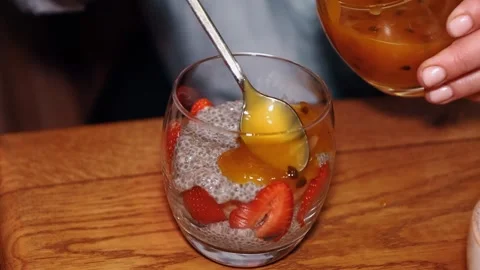Making chia pudding with strawberries Stock Footage 241797781