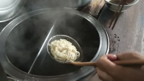 Making chicken noodles. View of a vendor of mie ayam bakso Stock Footage 258522458