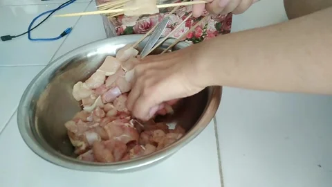 Making chicken satay in indonesia Stock Footage 217420874