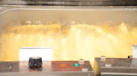 Making of Chinese dough stick  deep fried in  hot boiled oil on pan Video stock 61553960