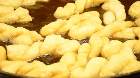 Making of Chinese dough stick  deep fried in  hot boiled oil on pan Video stock 61553974