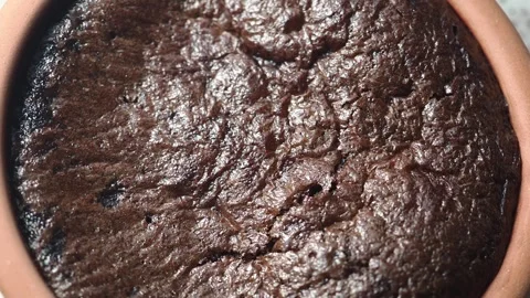 Making chocolate cake in a clay pot Stock Footage 342578394
