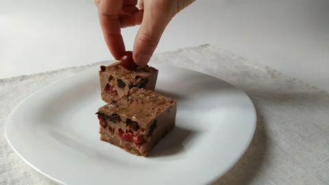 Making chocolate cheesecake with cherry assembly Stock Footage 109229172