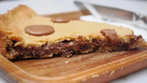 Making a chocolate chip cookie pie at home in the kitchen 스톡 동영상 345188644