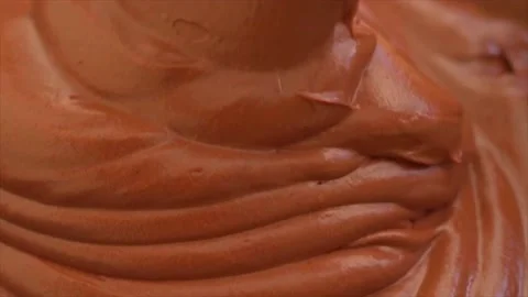 Making chocolate Mousse Cake , spreading smooth chocolate mousse on top of spong Stock Footage 205404433