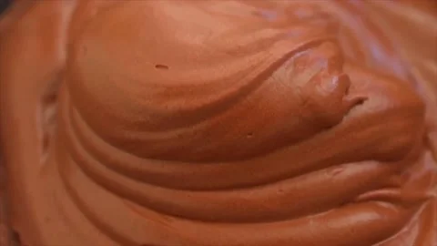 Making chocolate Mousse Cake , spreading smooth chocolate mousse on top of spong Stock Footage 205404434