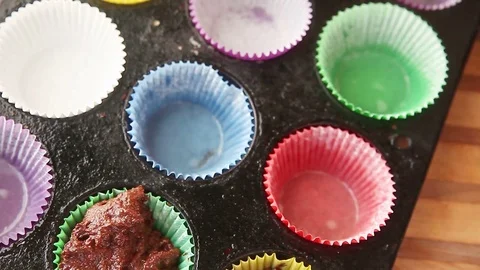 Making chocolate muffins with nuts Stock Footage 79228031