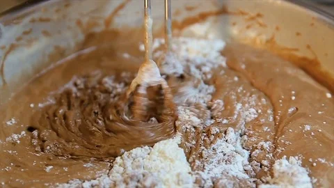 Making Chocolate Sponge Cake. Mixing beaten egg whites with chocolate dough Stock Footage 81879869