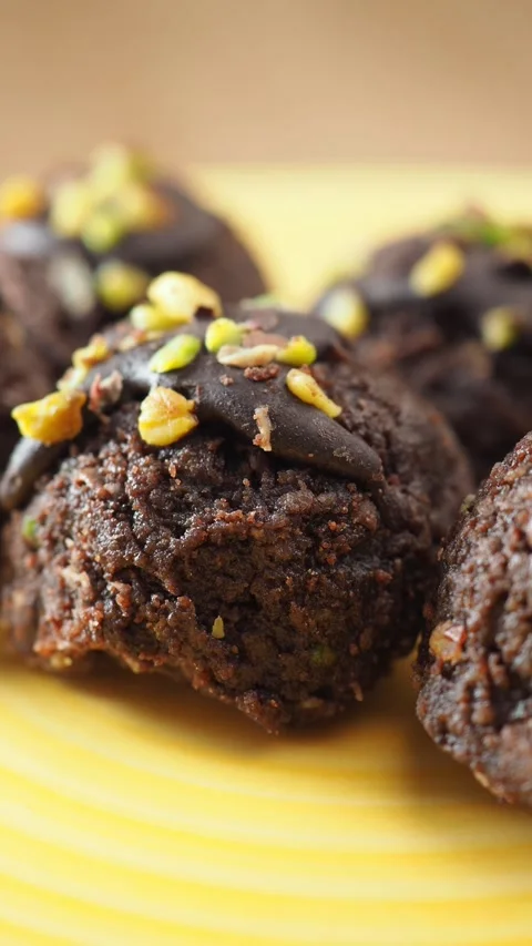 Making chocolate treats with nuts and sprinkles Stock Footage 336522500