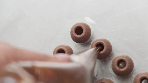Making chocolates. Filling up sweets. Stock Footage 132800307