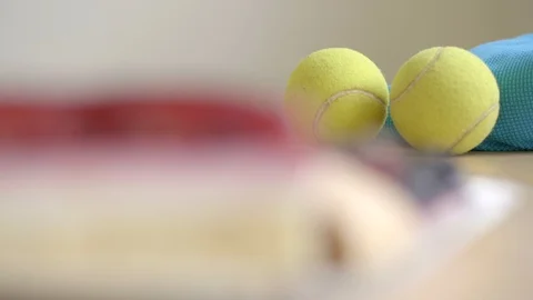 Making choice of sport or sweets, tennis balls and cakes, closeup Stock Footage 100193860