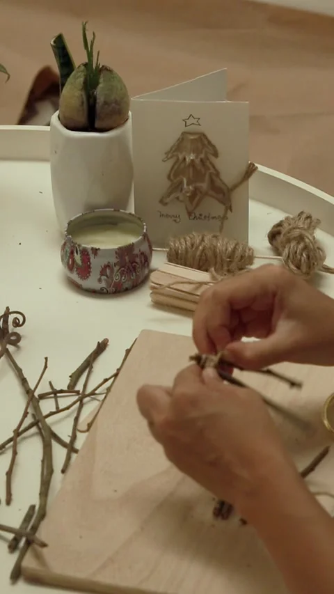 Making a Christmas star decor using twig and twine Stock Footage 294922312