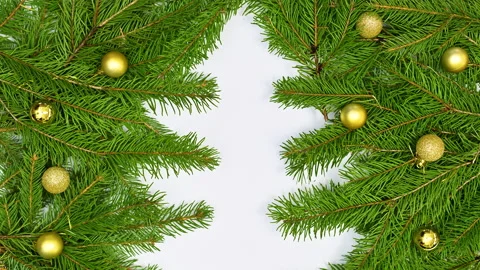 Making Christmas tree shape with natural pine branches and ornaments.Stop motion Stock-Footage 163215286
