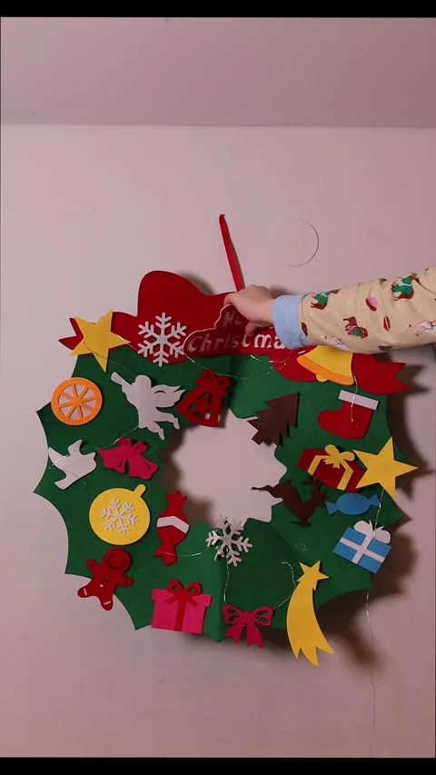 Making a Christmas wreath with simple craft materials for the holiday season Stock Footage 323211709
