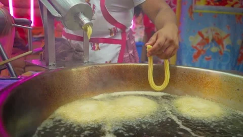 Making churros, adding oil for frying Stock Footage 295450374