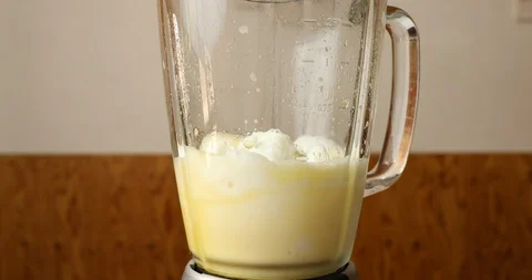 Making classic egg milkshake in blender Stock Footage 114203966