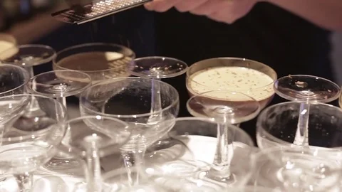 Making a Cocktail - Adding Grated Chocolate Stock Footage 77033818