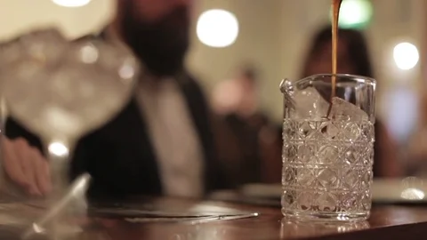 Making a Cocktail - Adding a Measure of Caramel Stock Footage 77034571