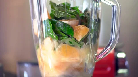 Making a cocktail in a blender close-up Stock Footage 128118597