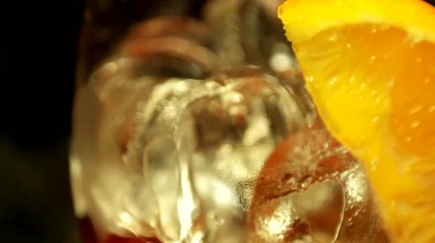 Making cocktail with ice and orange, closeup Stock Footage 65366819