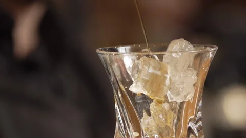 Making a cocktail with ice cubes Stock Footage 236994962