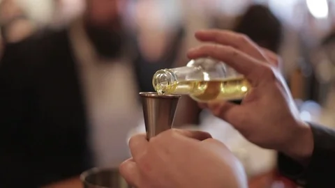 Making a Cocktail - Measuring the Liqueur Video stock 77033256